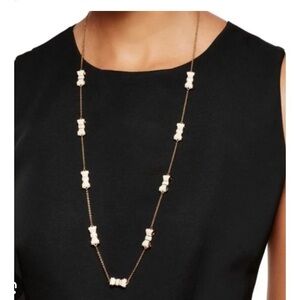 Kate Spade “Take a Bow” gold tone long necklace